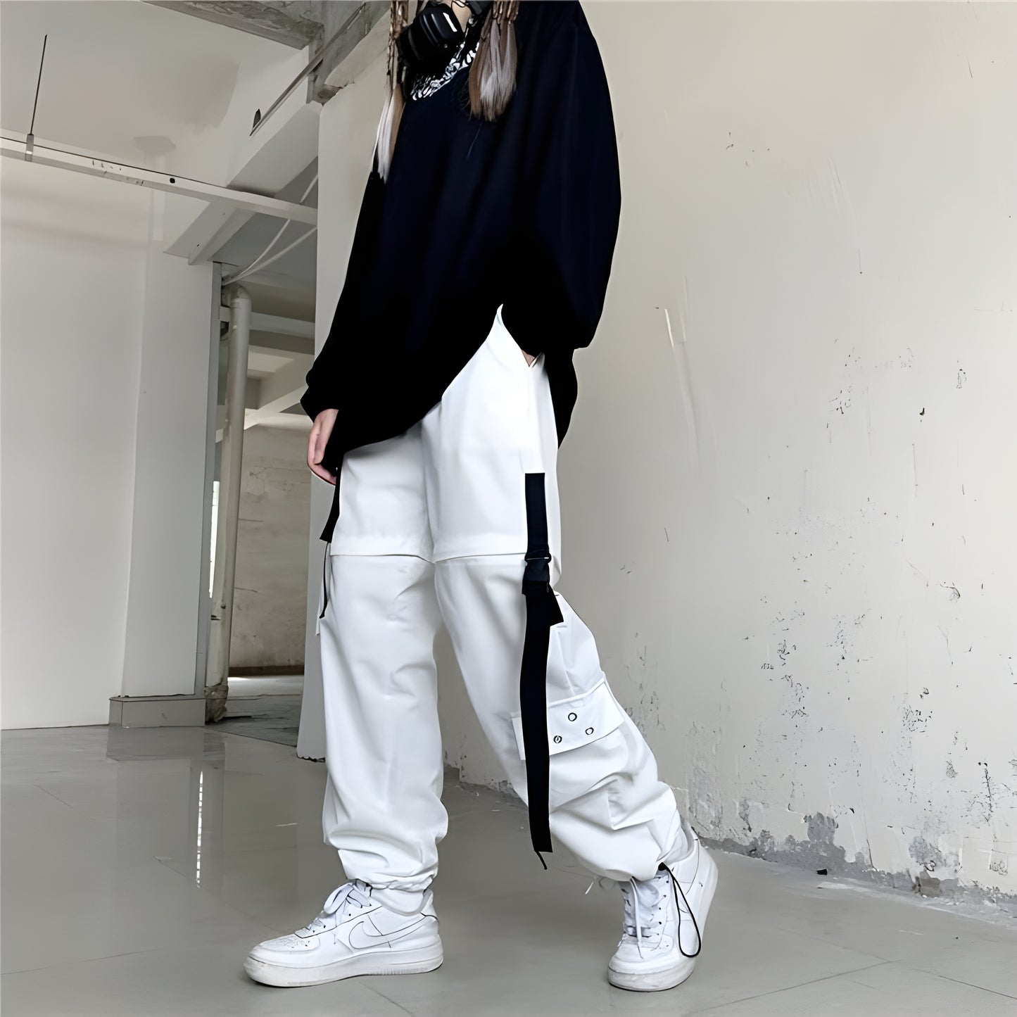 Female model showcasing the front view of women's techwear white pants, emphasizing the contemporary design and functional features, perfect for the Canada market.