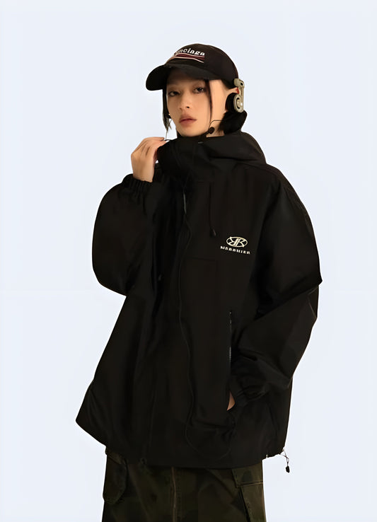 Front side view of a woman wearing a women's windbreaker jacket, showcasing its sleek design and functional features for active lifestyles in the  Canada.