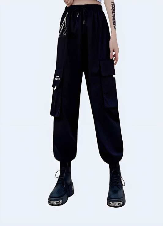 Edgy and functional techwear women's pants with chain detail, designed for urban fashion lovers in the Canada.