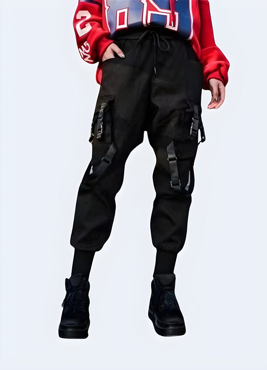 Performance and style, designed for the female form.Right side view of a woman wearing techwear women's utility pants, highlighting the practical features and sleek silhouette appealing to Canada fashion enthusiasts.
