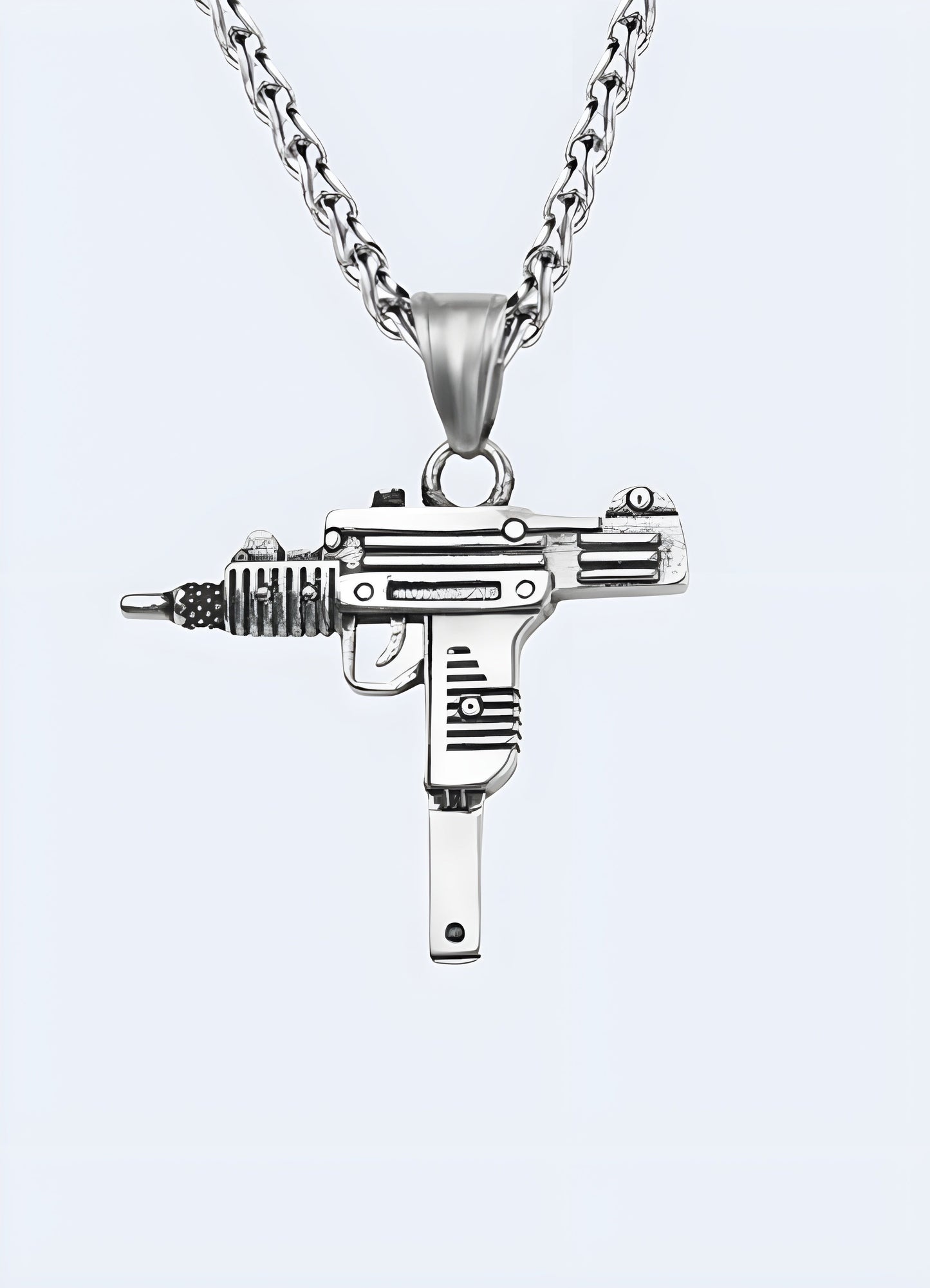 Silver Uzi necklace viewed from the front, featuring a detailed pendant in the shape of the well-known firearm Canada.