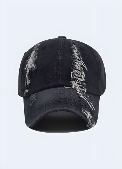 A front view of a black cap with a washed-out, vintage appearance. The fabric has a slightly faded look, giving it a worn-in, distressed style.