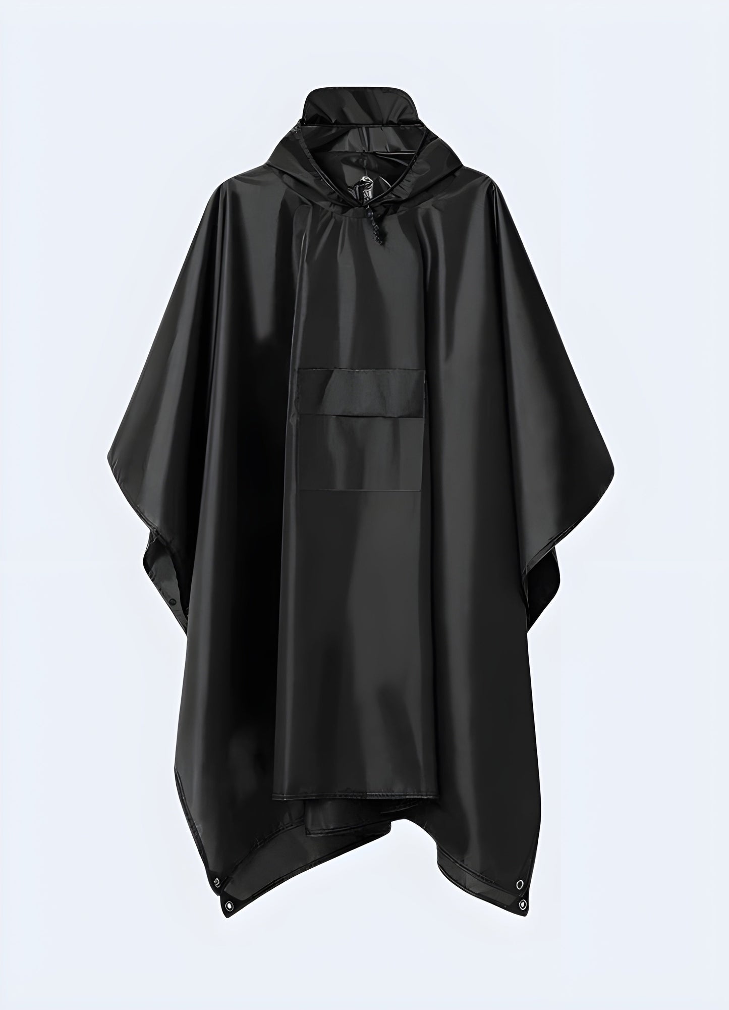 Front view of a person wearing a cutting-edge waterproof techwear poncho in wet Canadian conditions, highlighting the garment's advanced technology and practicality for outdoor enthusiasts.