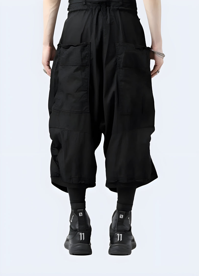  Back view of high-quality waxed techwear Sarwell pants in black, showcasing their sleek design and functional features for fashion-forward individuals in Canada.