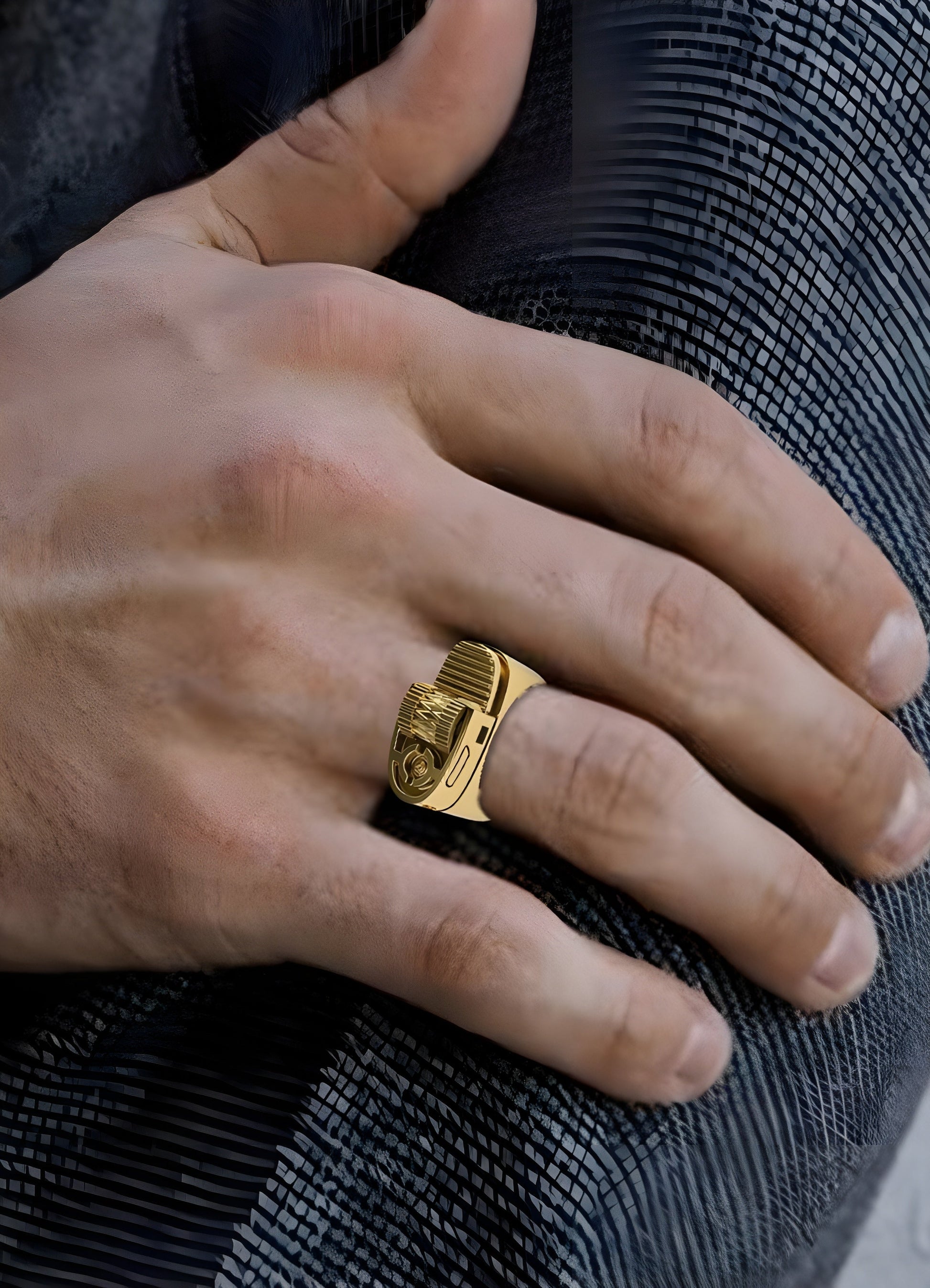 Person wearing a gold lighter ring, displayed in a front view to showcase its unique design and modern aesthetic Canada.