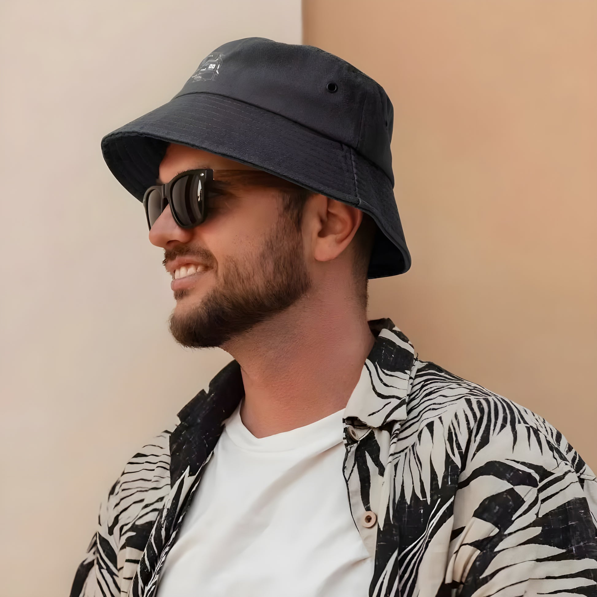 A model wearing a black cyberpunk bucket hat, viewed from the front to demonstrate the hat’s fit and its integration into a futuristic ensemble Canada.