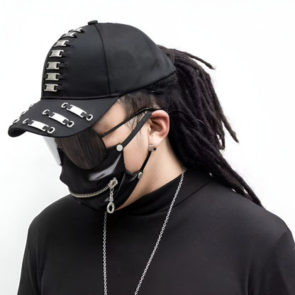 A Canadian model wearing a black darkwear cap with metal frame tags, viewed from the side. 