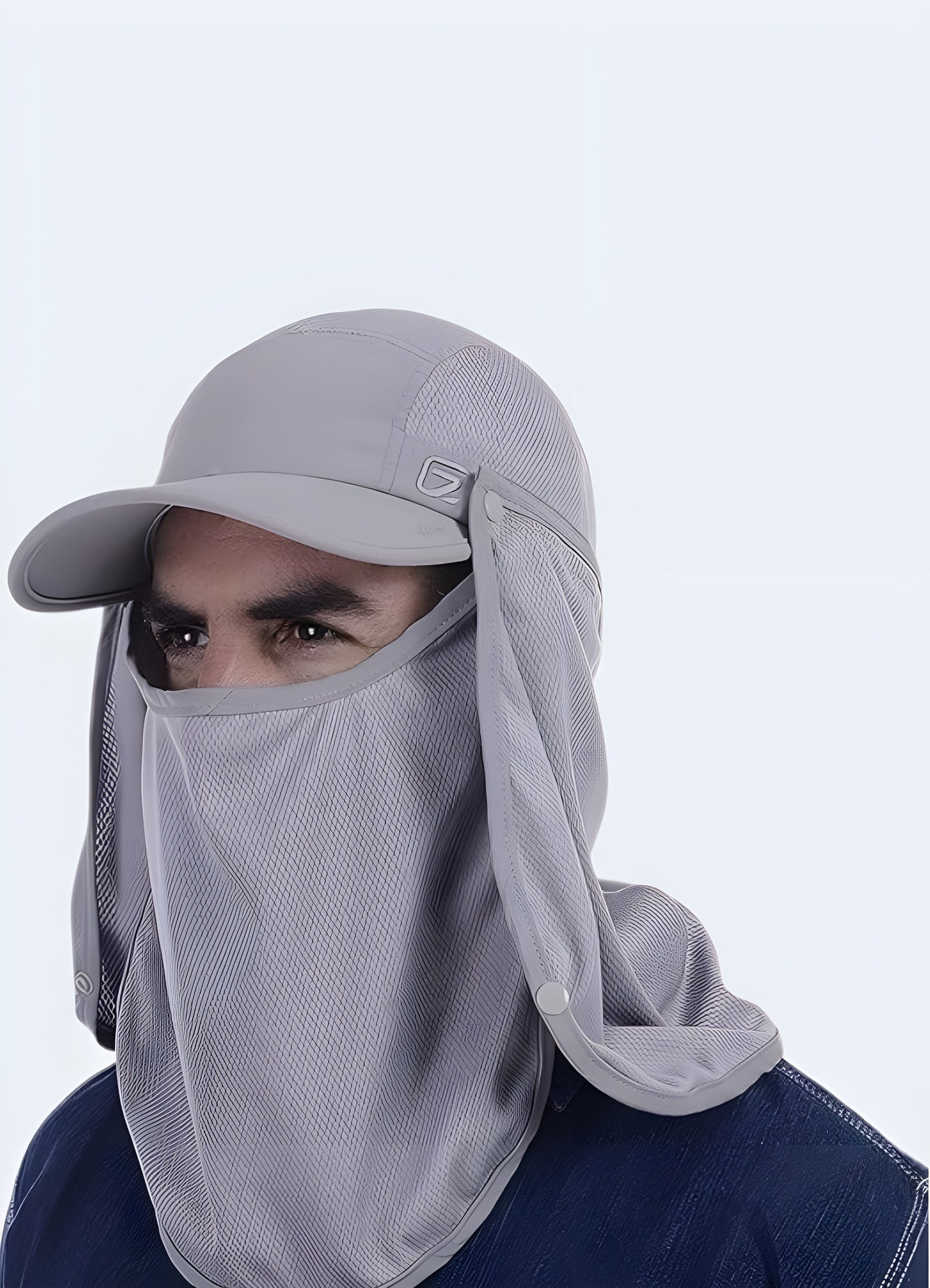 Model wearing a techwear neck flap cap in grey, side view, showcasing the cap's functional design and extended neck protection, available in Canada.