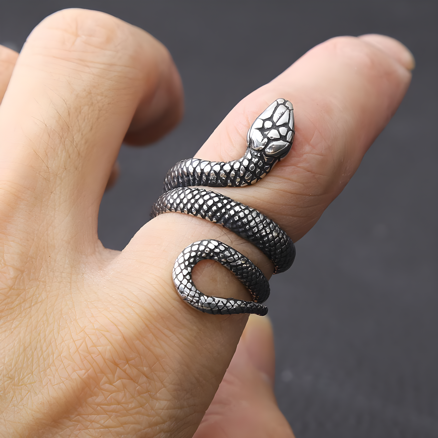 This brushed silver snake ring, shaped as a coiled serpent, adds a touch of mystery and intrigue.