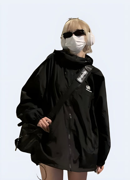 Front view of a woman sporting a women's techwear windbreaker jacket, highlighting its stylish look and practical benefits for facing windy conditions in the Canada.