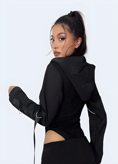 Back view of a woman in a chic black hoodie bodysuit, highlighting its unique design features and practicality for Canada urban fashion.