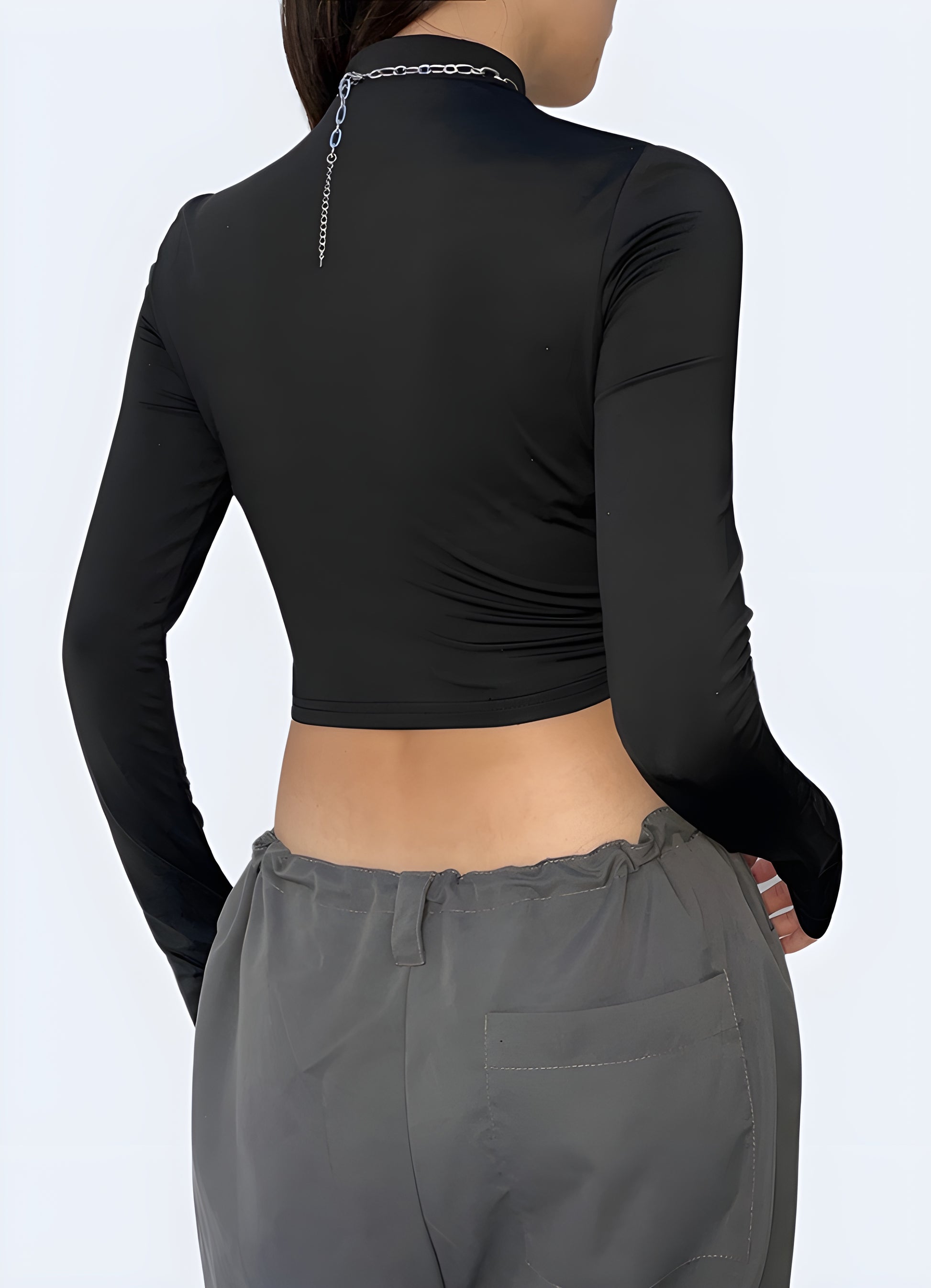 Back view of a woman wearing a classic black turtleneck bodysuit, highlighting its sleek, flattering fit and versatile design. Perfect for Canadian wearers looking for a timeless, wardrobe-essential piece that combines style and comfort.