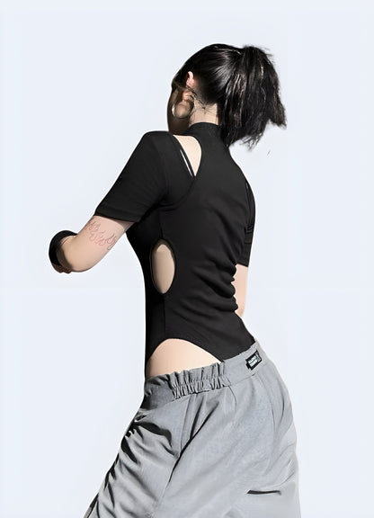 Back view of a woman in a black techwear leotard, highlighting the garment's unique design and functionality for Canada techwear enthusiasts.