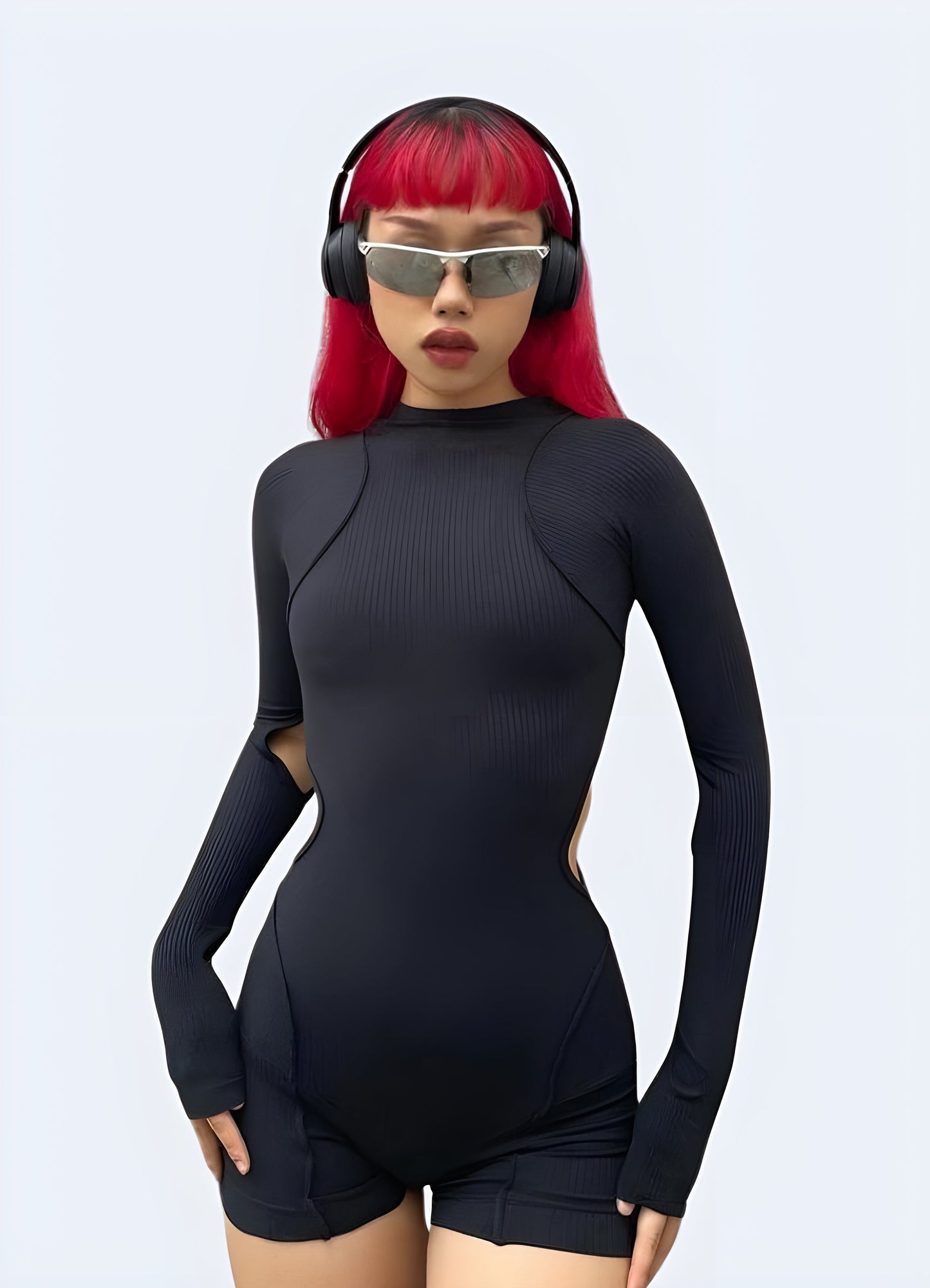 Canada model showcasing a front view of a contemporary techwear playsuit, highlighting its sleek lines and modern appeal for urban fashion.