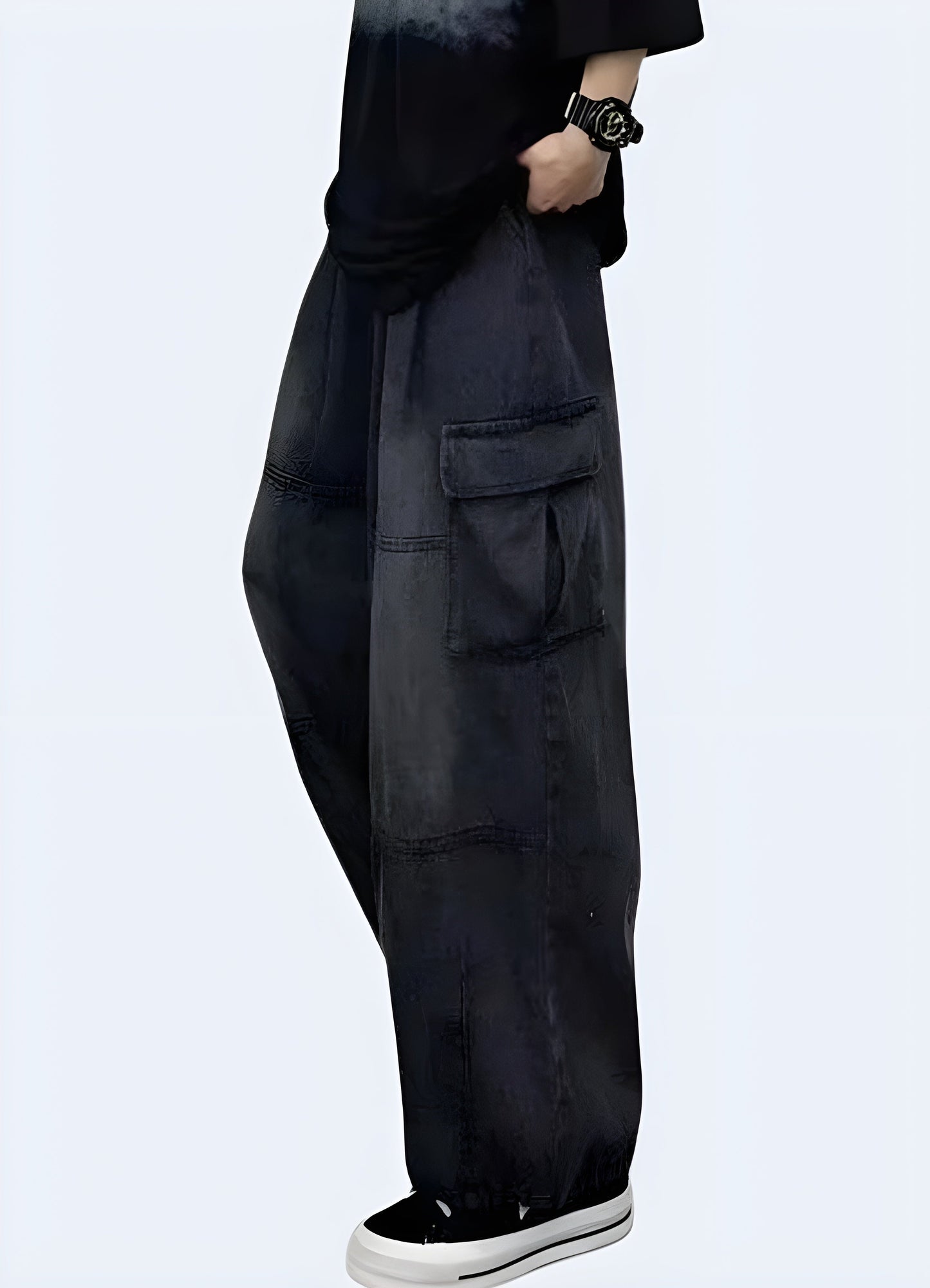 Side view of a woman wearing trendy black baggy cargo pants, showcasing the relaxed fit and versatile style, available for Canada customers.