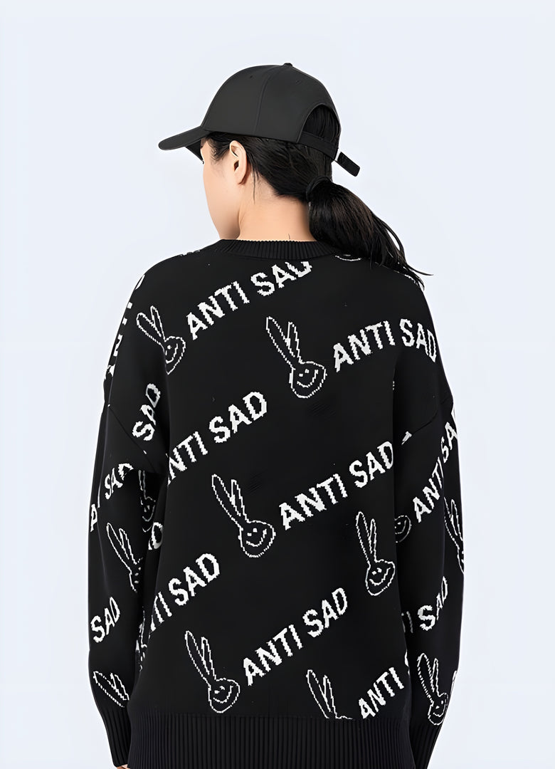  Woman wearing a black anti-sad sweatshirt, back view, in Canada. Trendy and uplifting apparel for casual outfits.