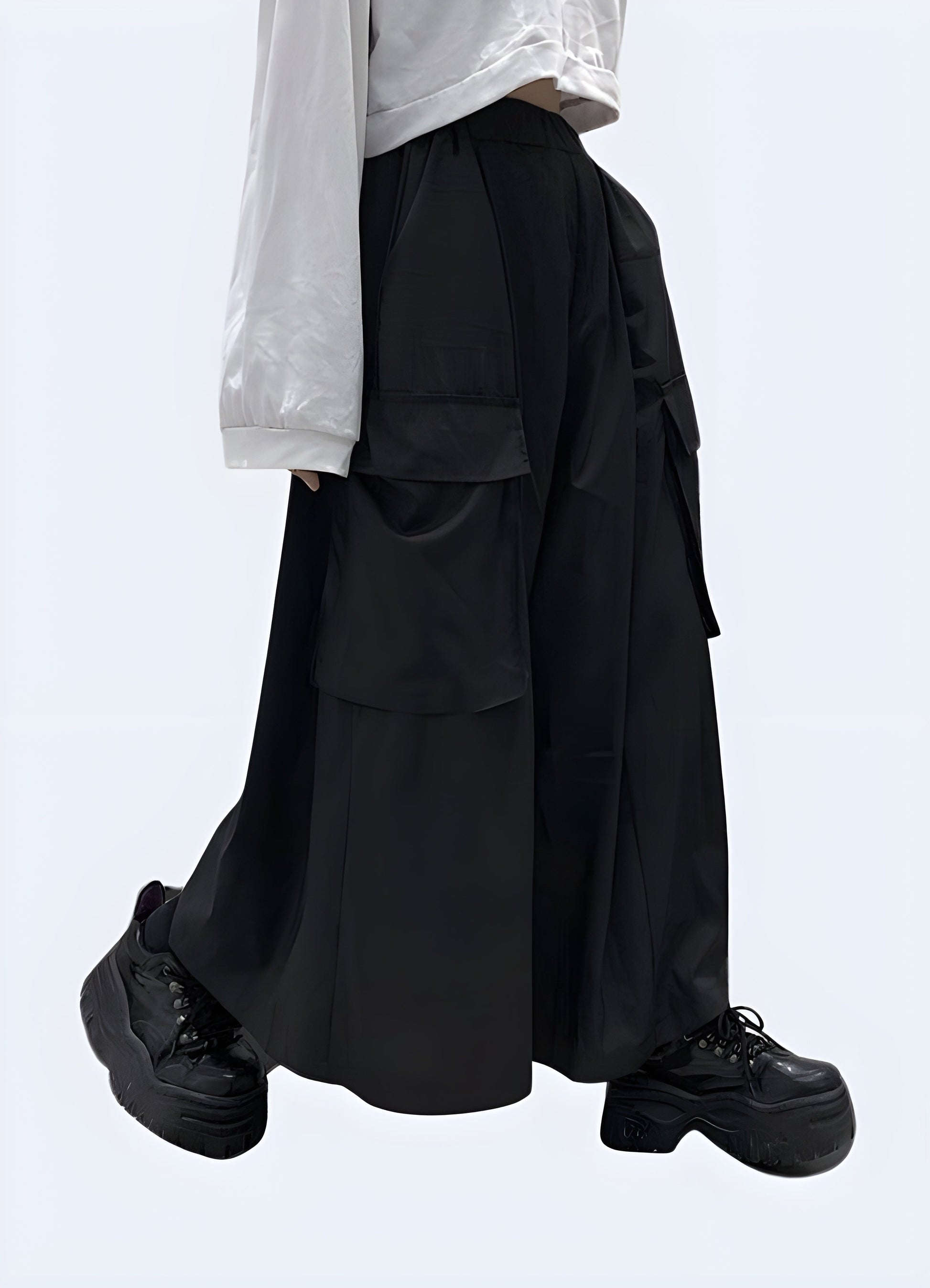 Side view of a woman wearing stylish black hakama pants, highlighting the unique pleated structure and comfortable fit, available for women in the Canada.