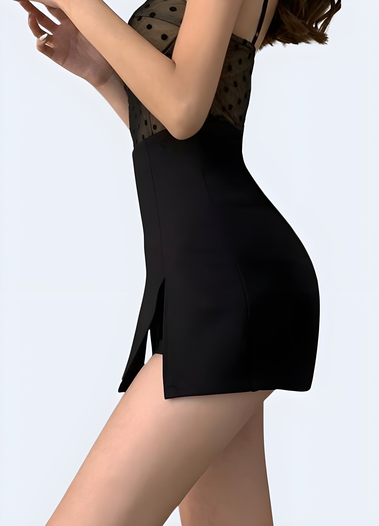 Side view of a woman sporting a black mini skirt, highlighting its sleek silhouette and versatile style for various occasions in the Canada.