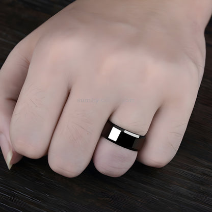 Woman wearing a black titanium ring, shown in a front view, highlighting the sleek and modern design of the ring Canada.