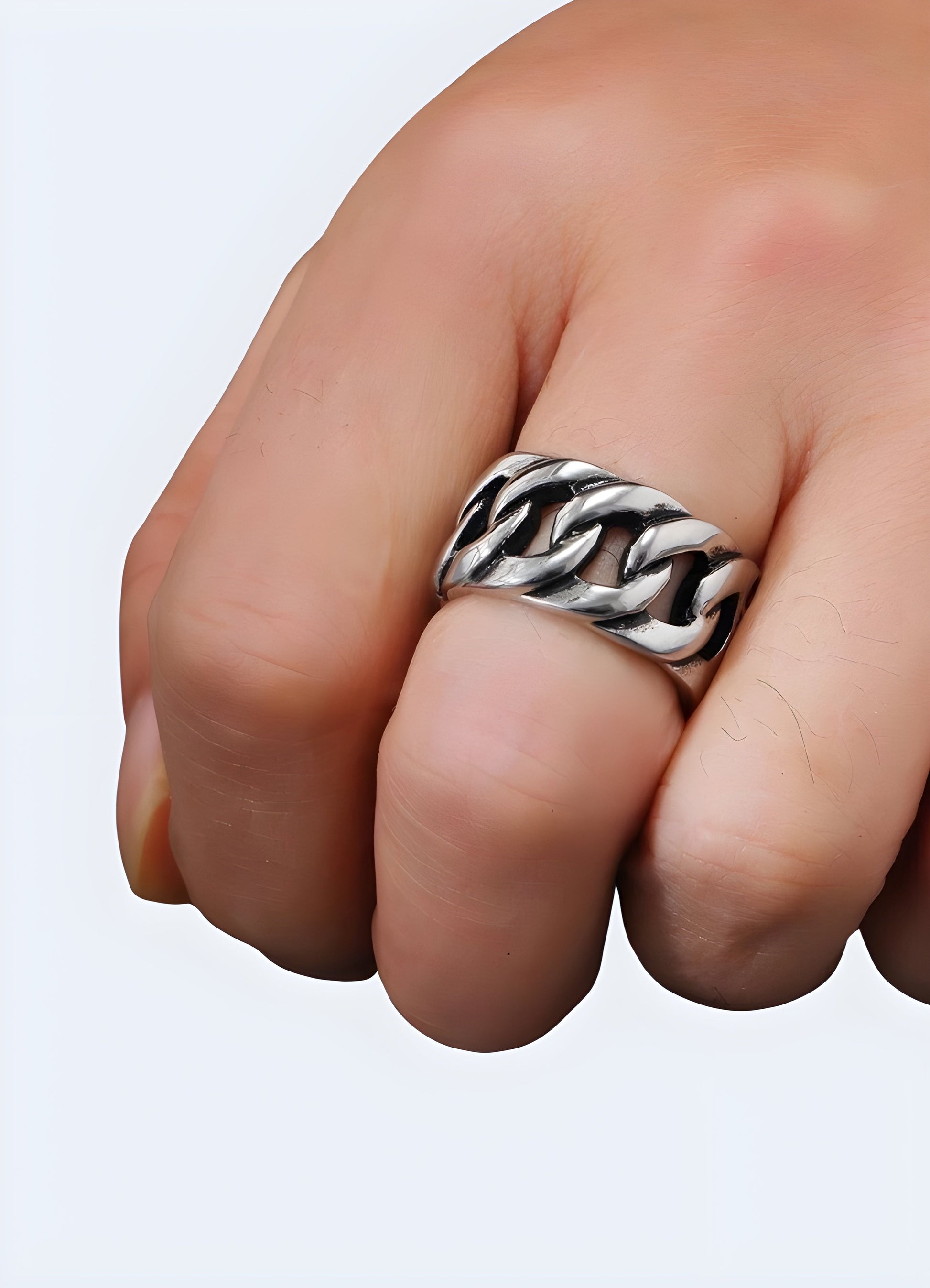 Close-up view of a black chain ring, featuring a sleek and intricate design Canada.