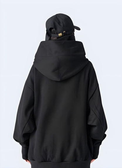 Woman wearing a black comfortable Harajuku hoodie, back view, in Canada. Showcasing modern streetwear style.