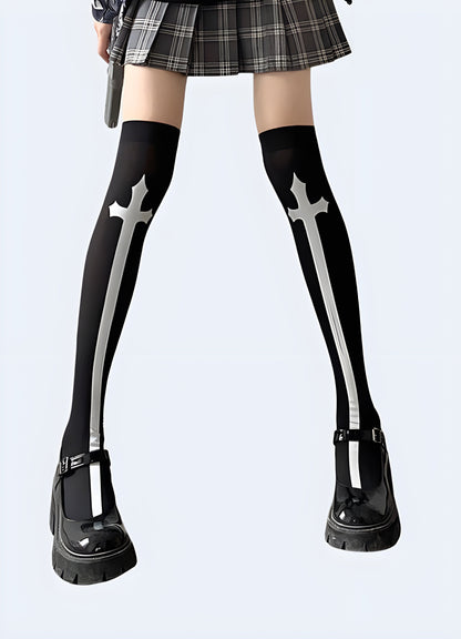 Front view of a woman wearing fashionable cross knee-high socks, showcasing the eye-catching pattern and sleek silhouette popular among Canada fashion enthusiasts.