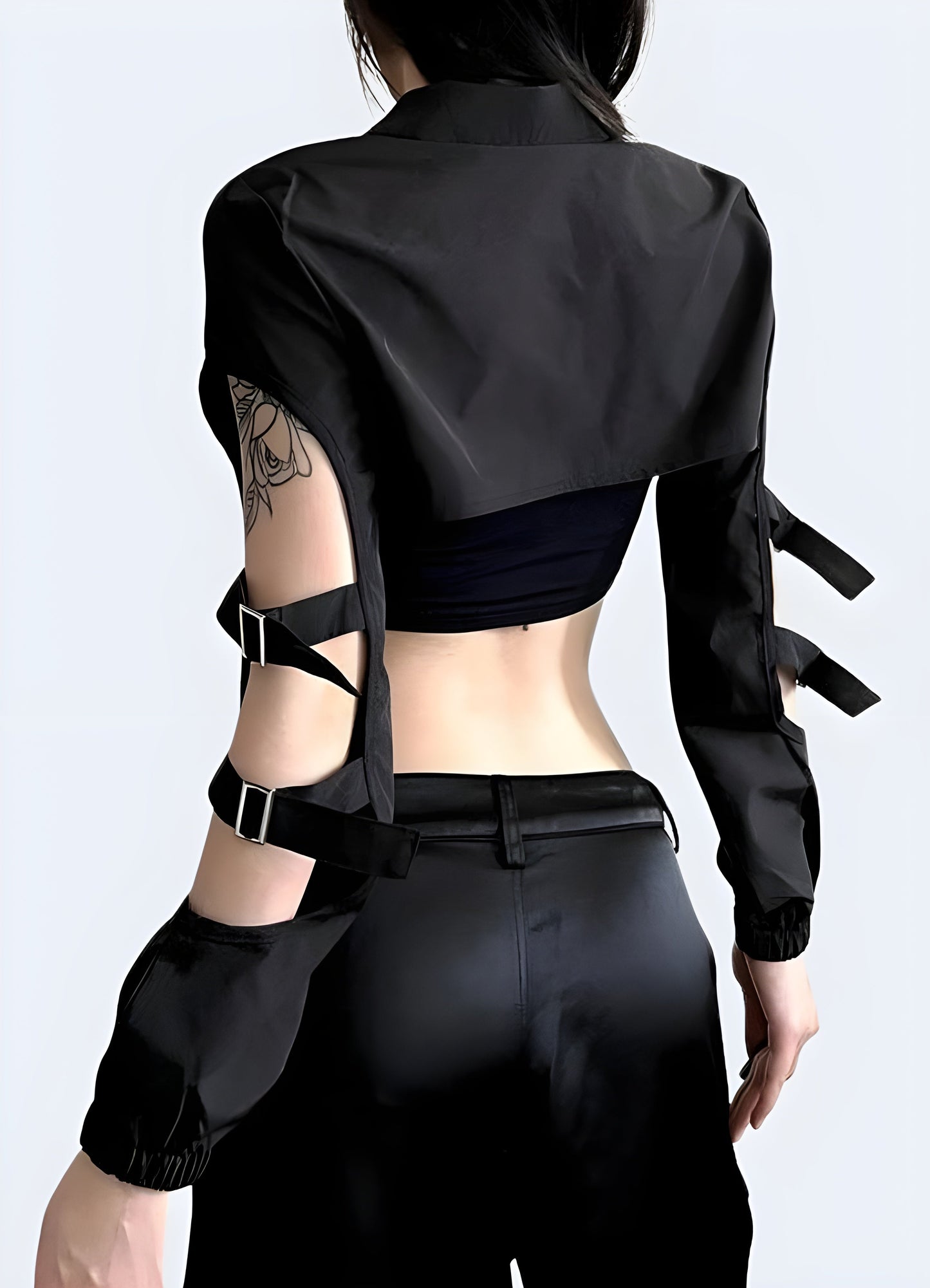 Back view of a woman wearing a cyberpunk black sleeves turtleneck, showcasing its unique sleeve detail and sleek silhouette for fashion-forward women in the canada.