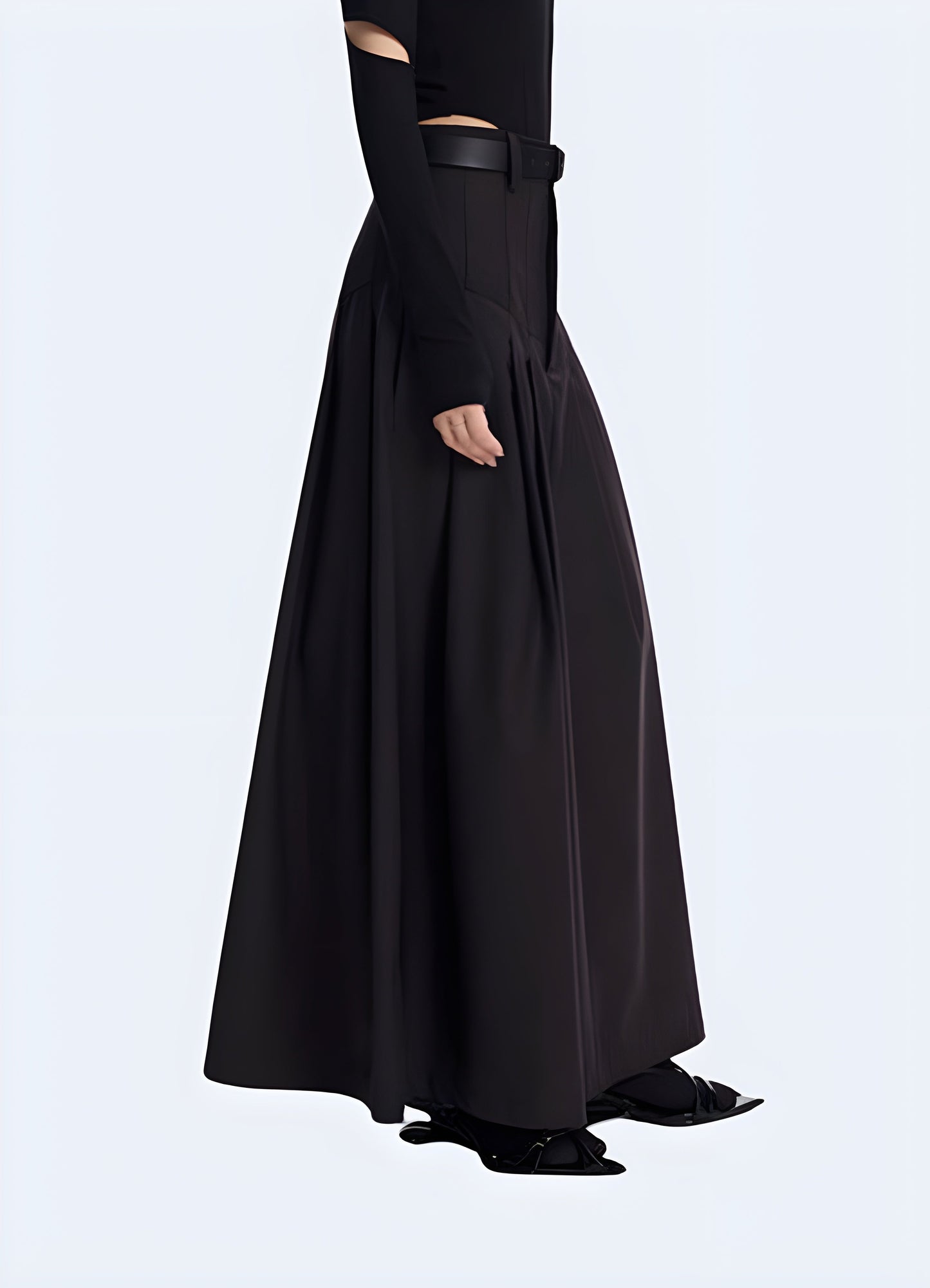 Side view of a woman wearing an elegant techwear skirt, highlighting the fusion of elegance and functionality, with clean lines and innovative features suitable for elevated urban fashion.