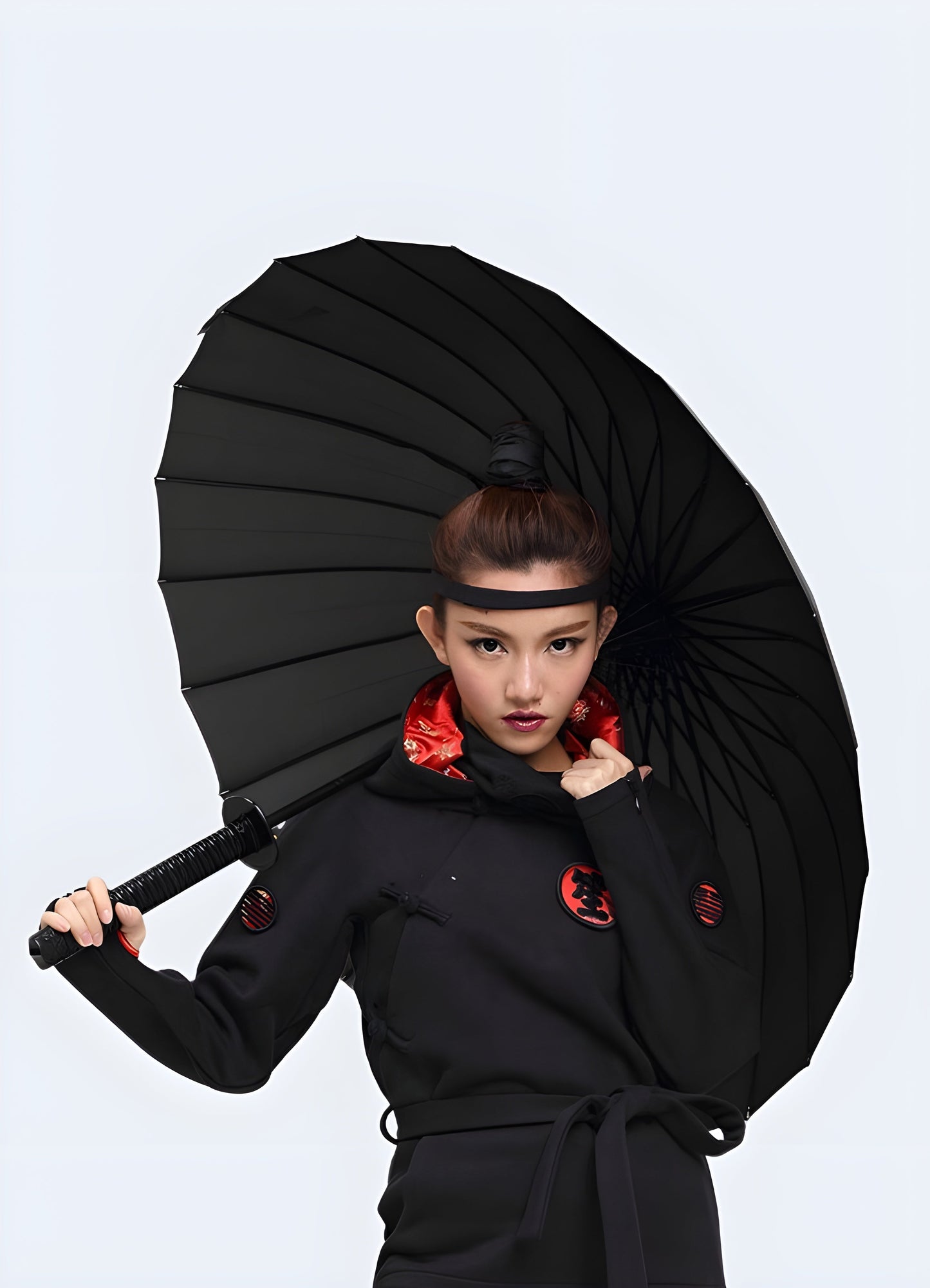 Woman holding a ninja sword umbrella with 24 ribs, shown from the front, highlighting the umbrella's sturdy construction and stylish design Canada.