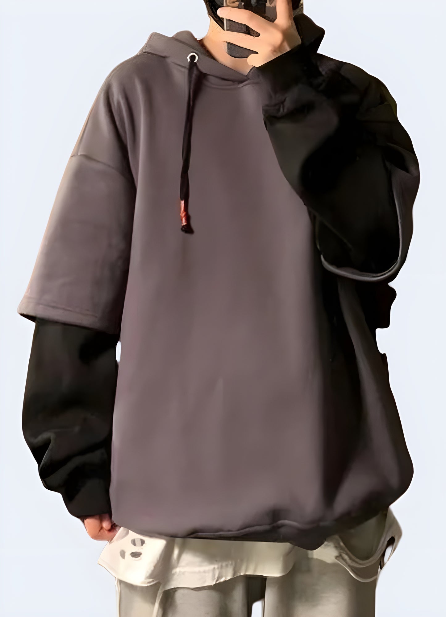 Woman flaunting the chic grey oversized techwear hoodie with Korean influence, front view, in Canada. 