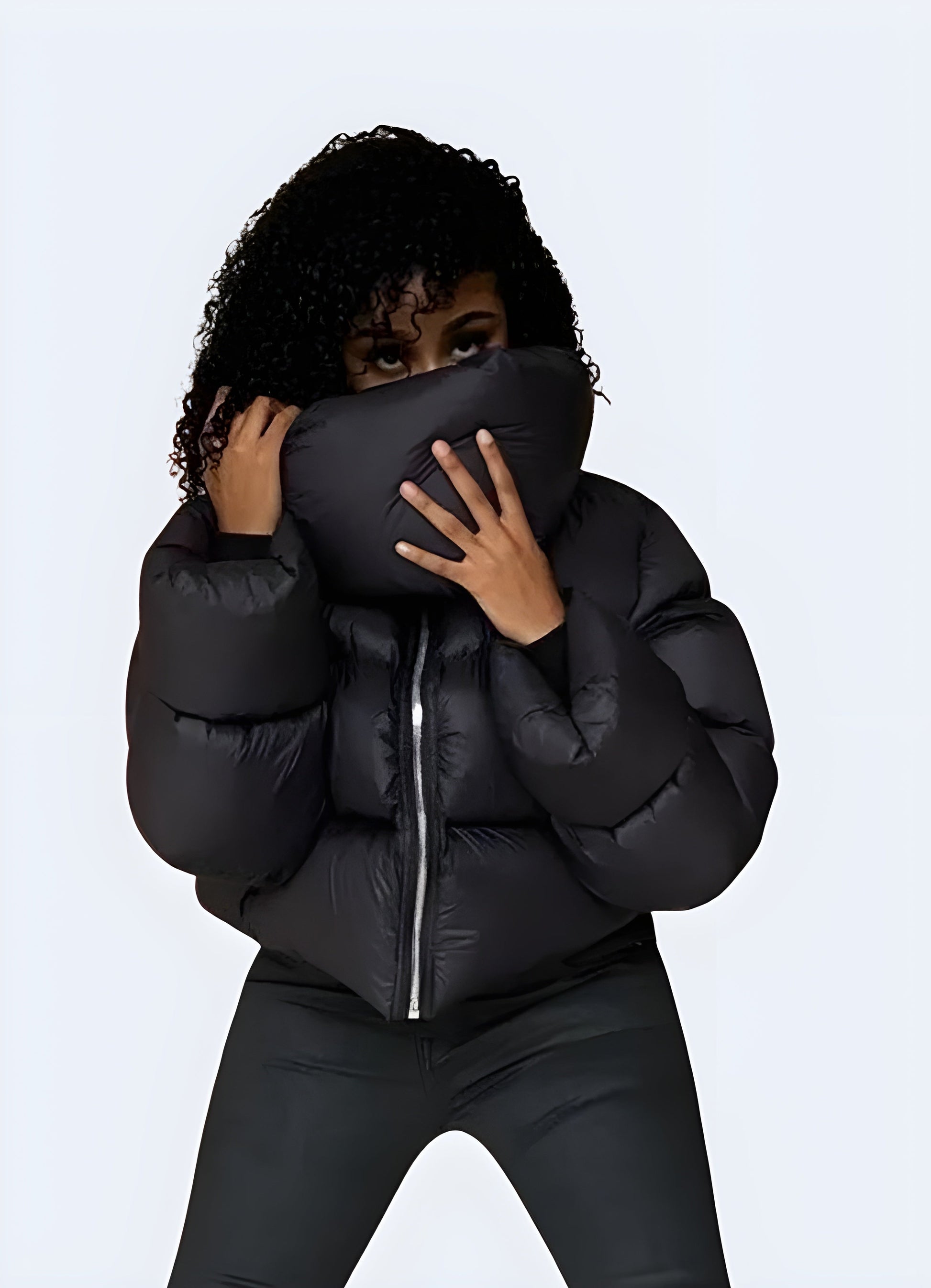 Front view of a woman sporting a techwear down puffer jacket, highlighting its fashionable design and advanced insulation technology for Canada women.