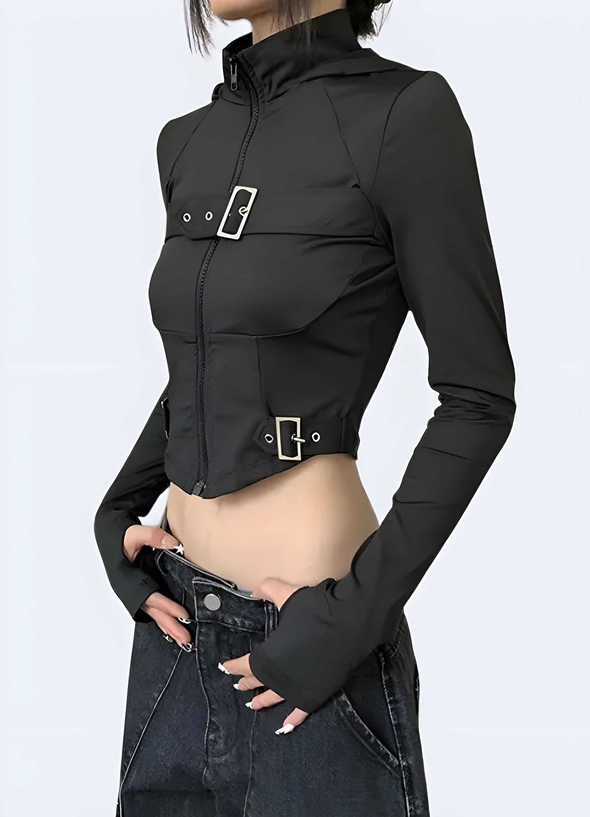 Side view of a woman sporting a techwear goth crop top, highlighting its unique silhouette and attention to detail for those embracing the goth subculture in the canada.