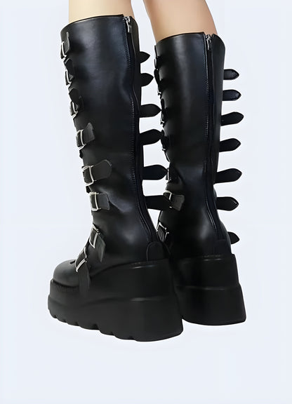 Back side view of a woman wearing techwear gothic buckle knee high boots, highlighting their intricate buckle details and sturdy construction, ideal for Canada alternative fashion enthusiasts.