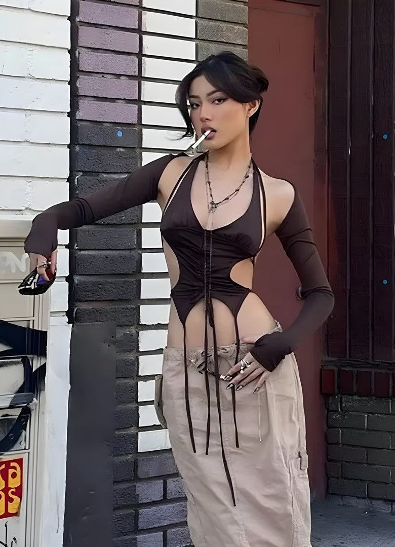 Front side view of a woman wearing a fashionable techwear lace-up crop top, showcasing contemporary style in Canada.