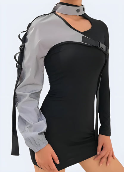 Front view of a woman wearing a techwear one-sleeve reflective top, showcasing stylish and contemporary fashion in Canada.