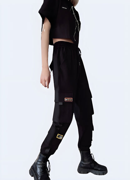 Side view of a woman wearing form-fitting womens techwear pants with adjustable hem,, highlighting the comfort and versatility of this popular style in the Canada.