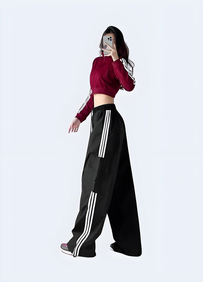 Side view of a woman wearing women's techwear streetwear pants, showcasing the trendy and practical design popular among Canada fashion enthusiasts.