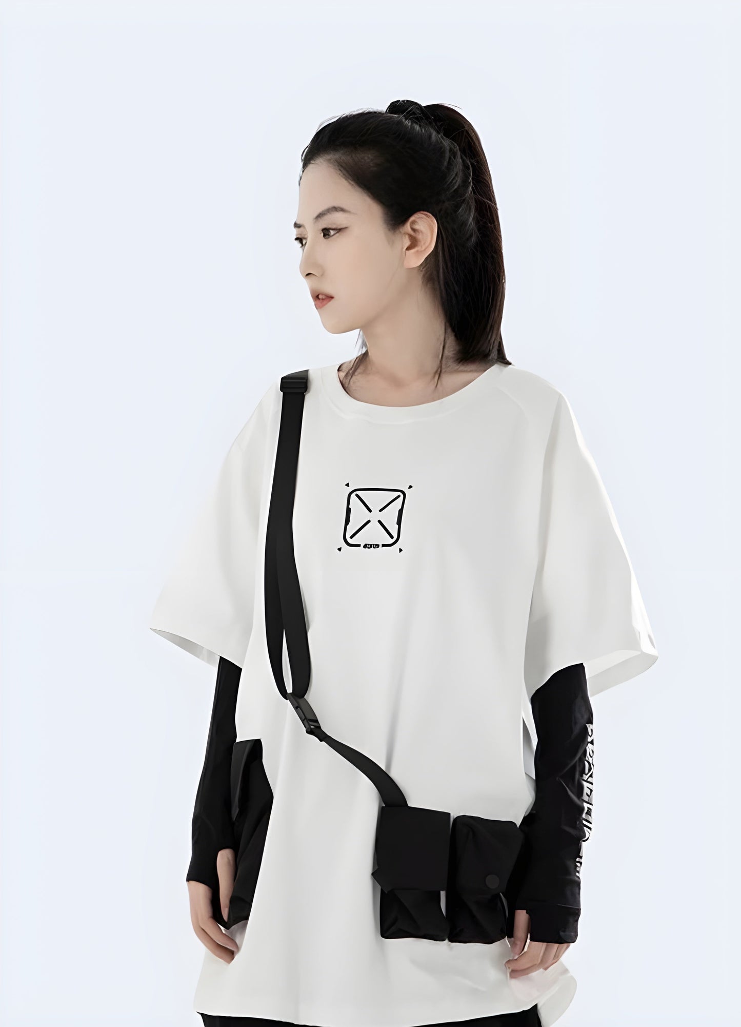 Front side view of a woman wearing a white techwear women's tactical shirt with pockets, perfect for versatile urban wear in Canada.