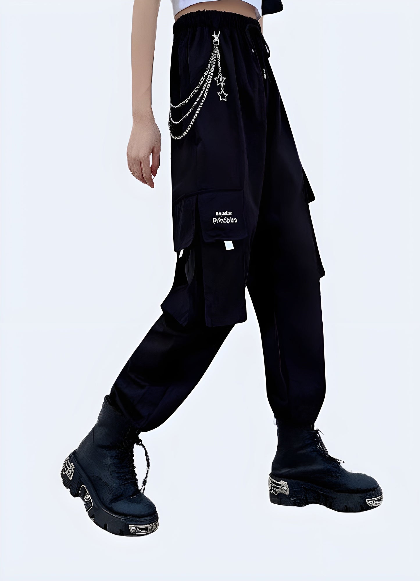 Front side view of a woman wearing stylish techwear women's pants with a chain accent, showcasing the blend of fashion and utility popular in Canada street style.