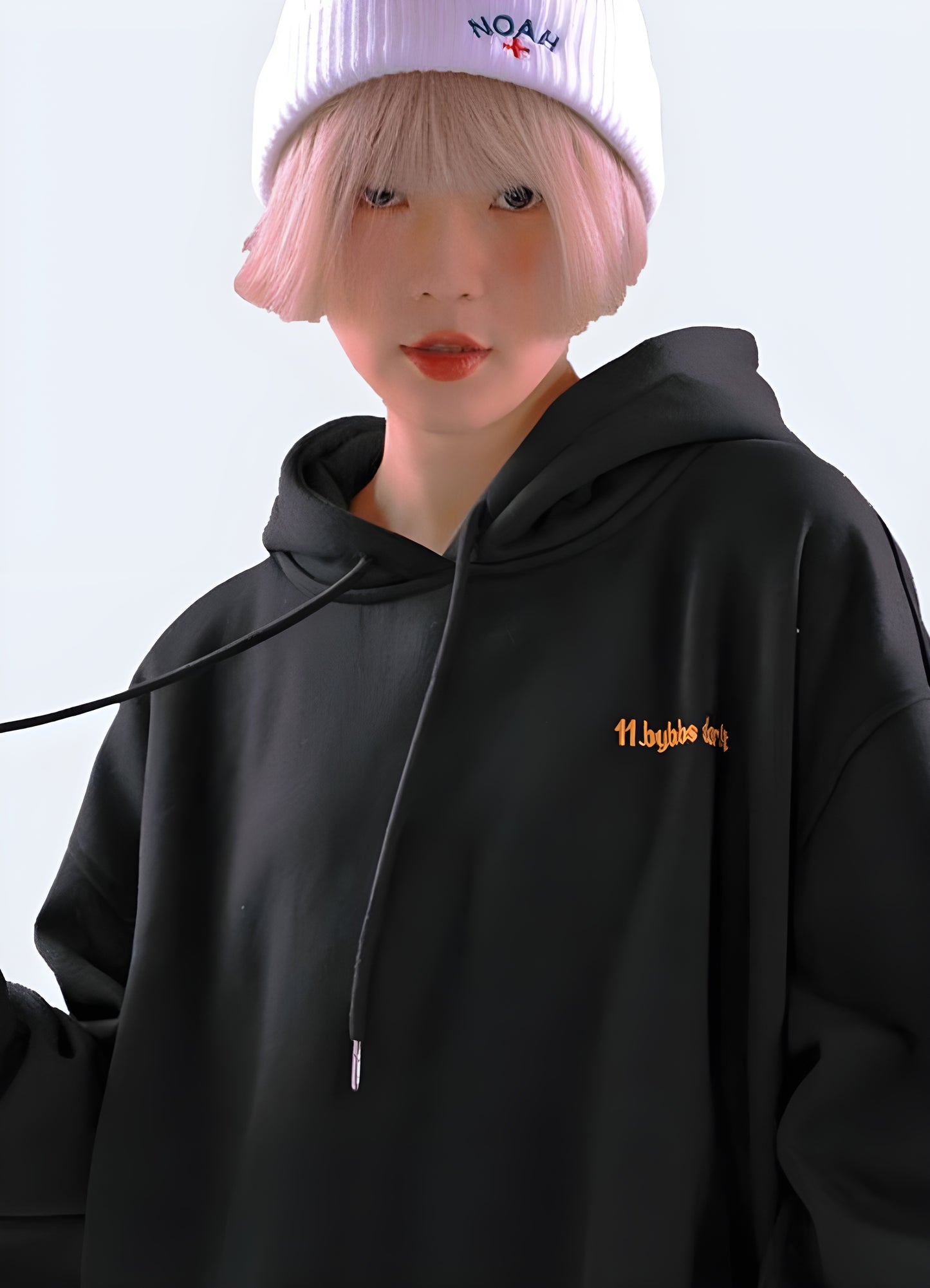 Woman wearing a women's Harajuku techwear hoodie, plus size, front view, showcasing urban style in Canada