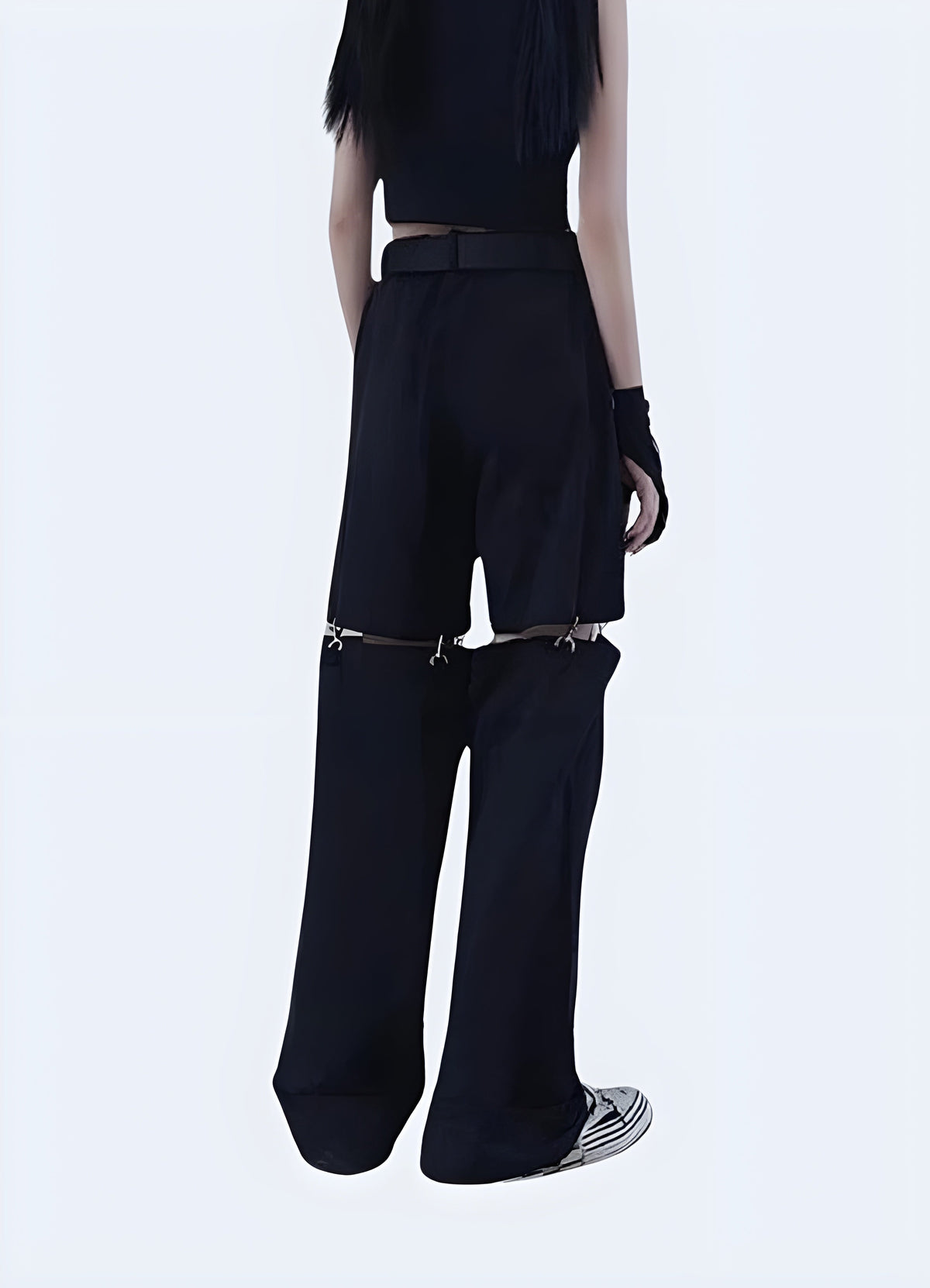 Close view of the zip-off knee seam and zip hardware on women's detachable cargo pants
