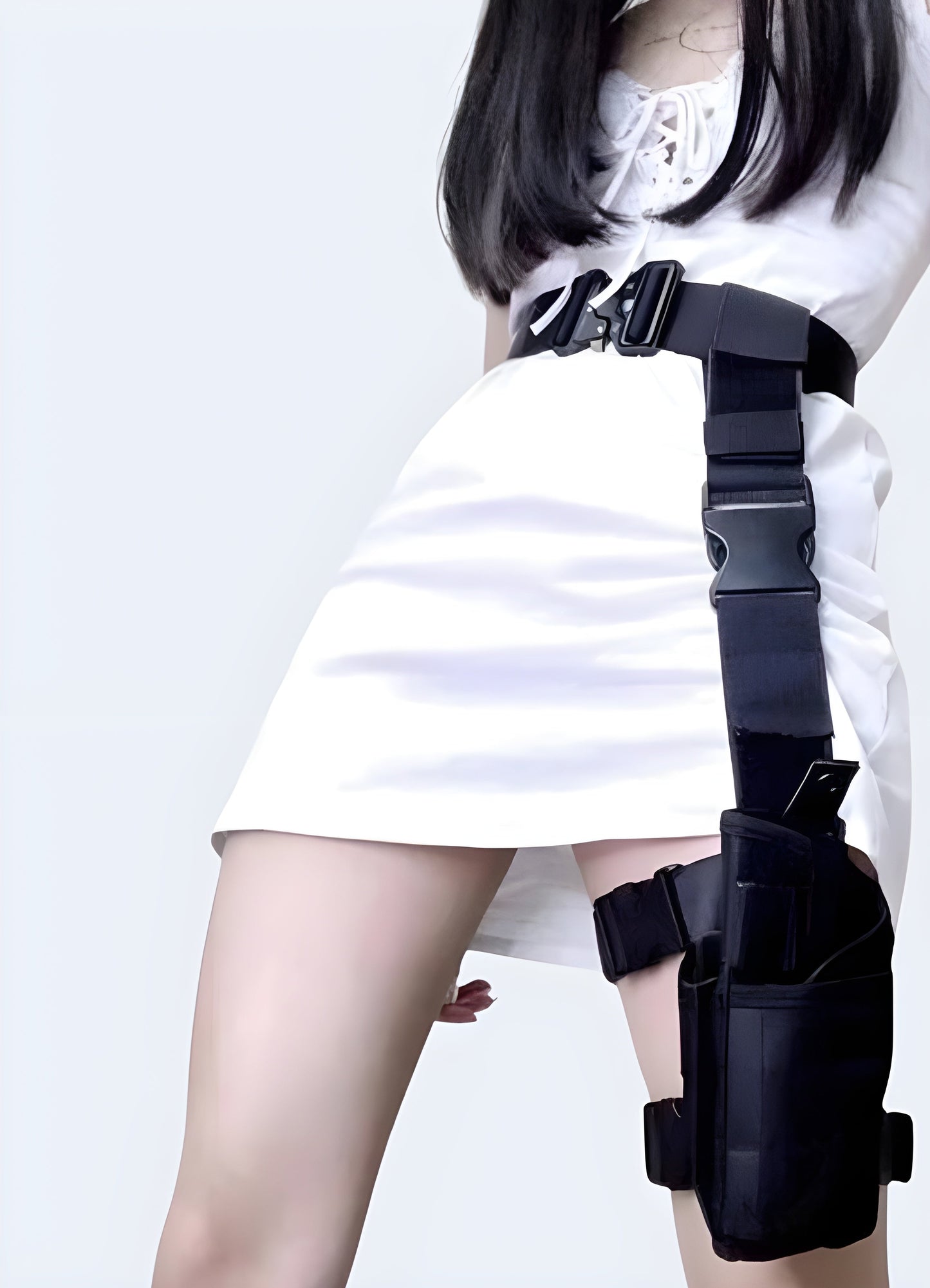 A woman wearing a tactical leg bag, viewed from the front. The bag has multiple pockets and adjustable straps, worn on the thigh with a rugged and practical design Canada.