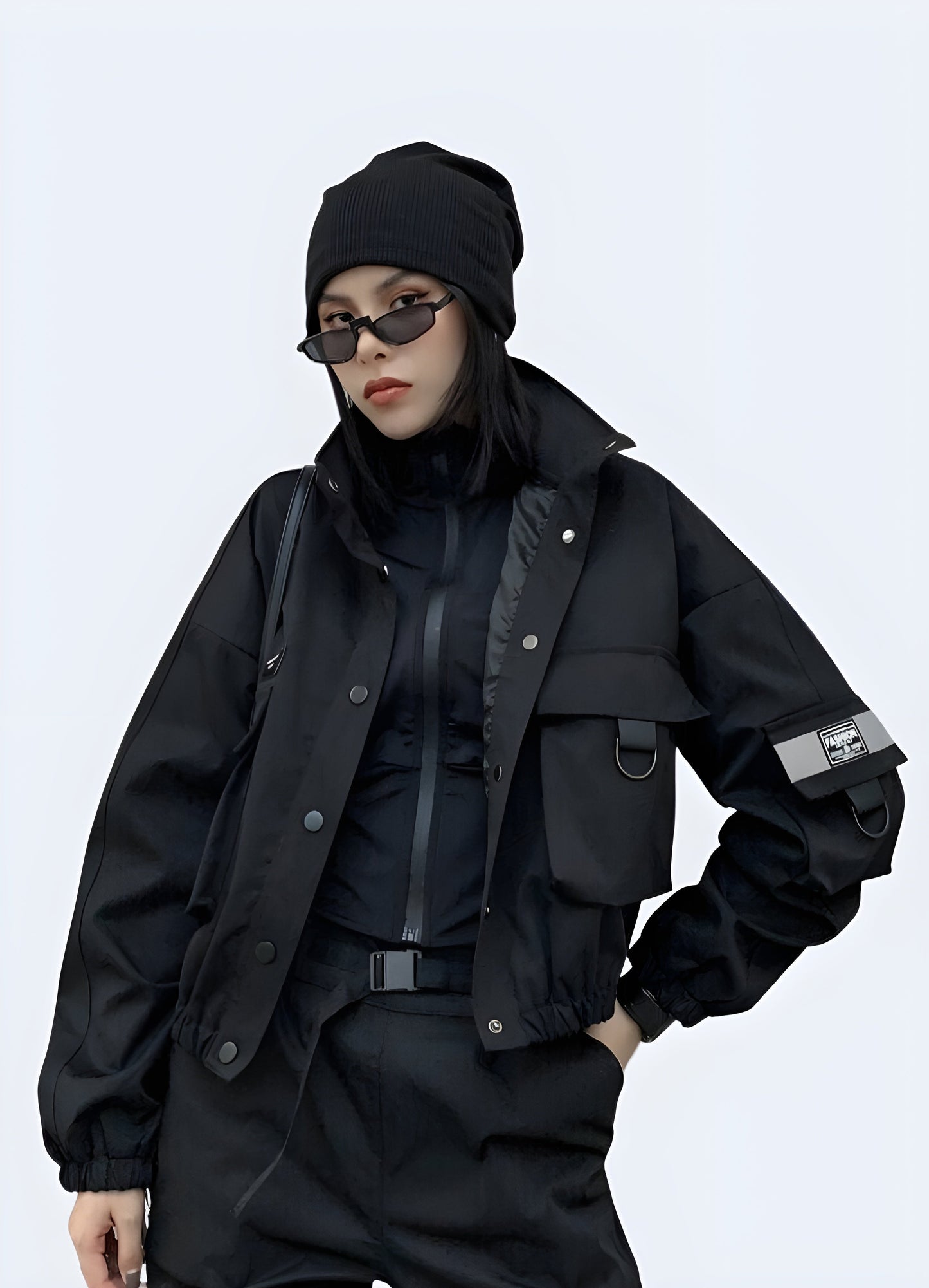 Front view of a woman wearing a black tactical bomber women, showcasing its sleek design and functional features for city life in the Canada.