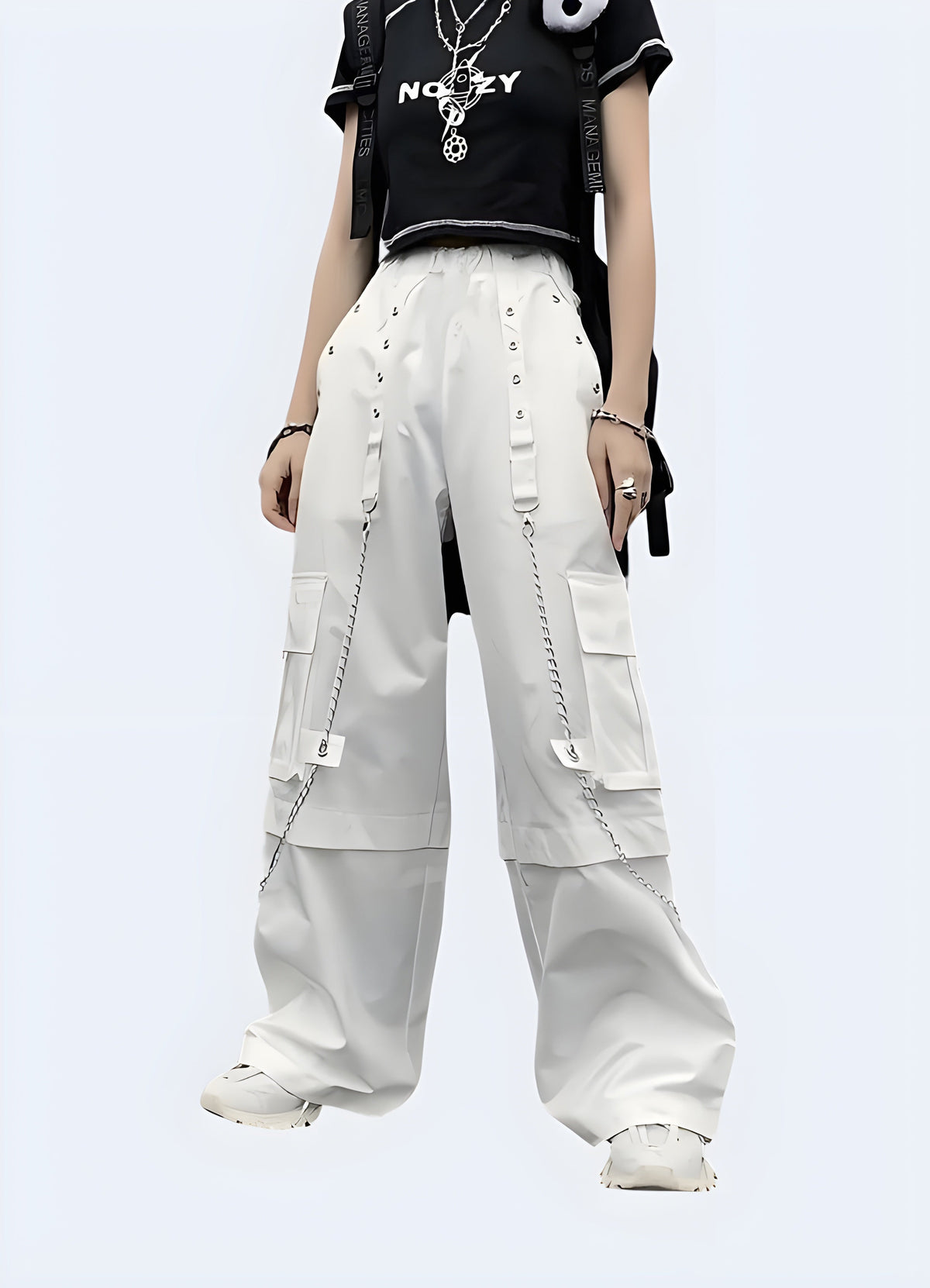 White cargo pants, side view with pocket flaps and seam detail along the leg