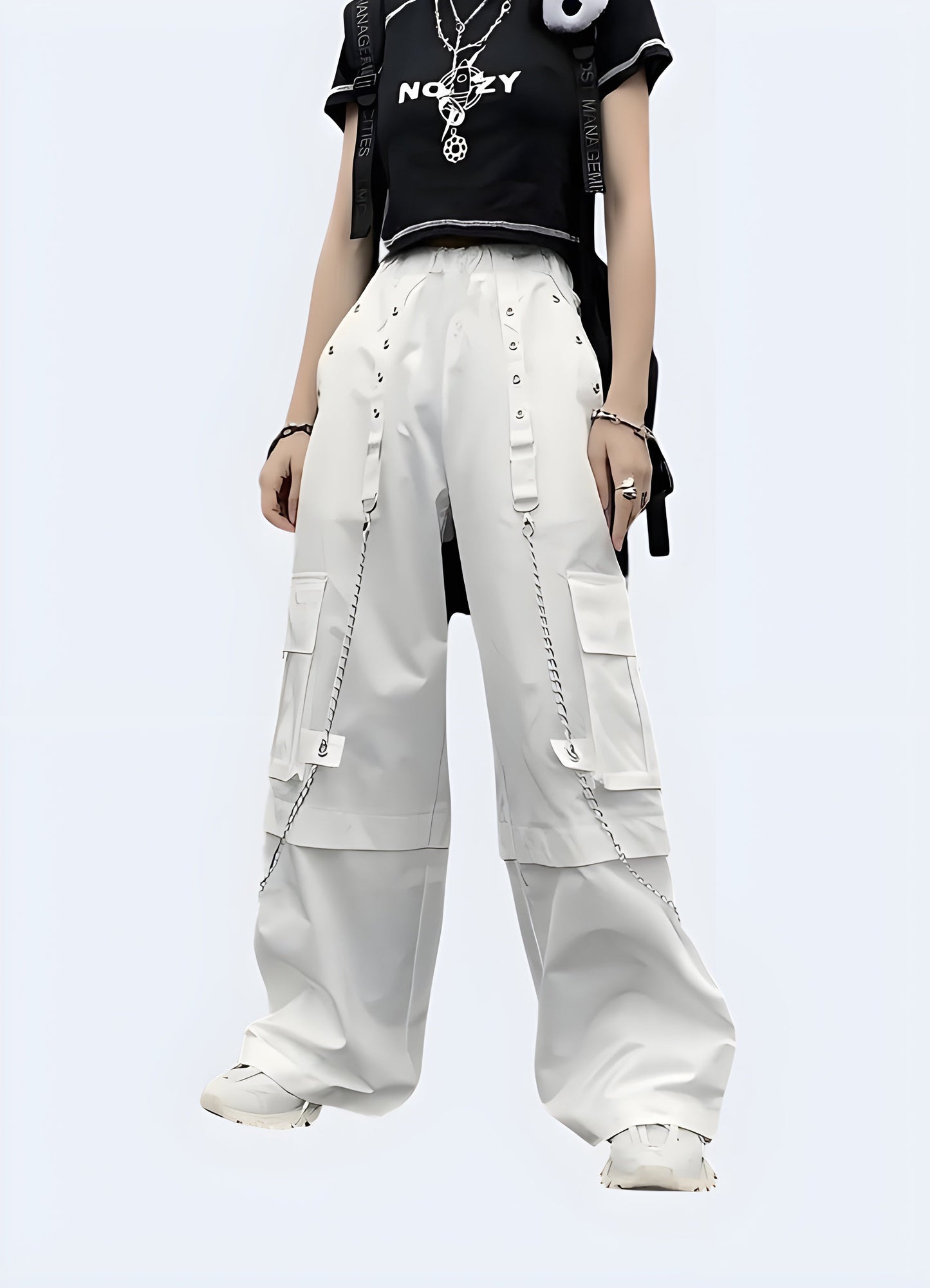  Front view of a woman wearing trendy punk cargo pants white embellished with silver chains, captured in a contemporary Canada environment, highlighting the fusion of functional and rebellious fashion elements.