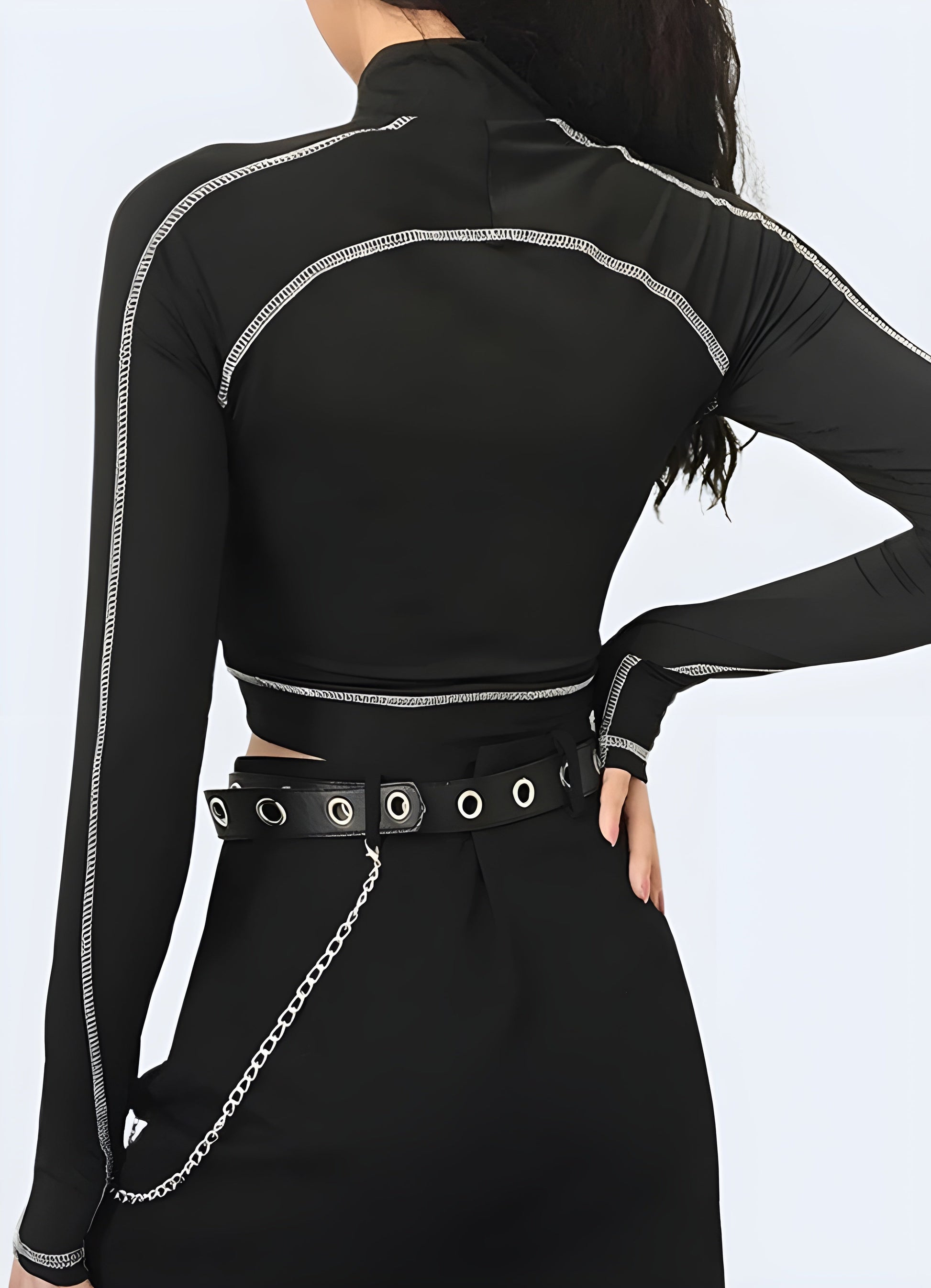 Woman wearing a techwear crop top, showcasing the garment's unique back design, captured in the Canada.